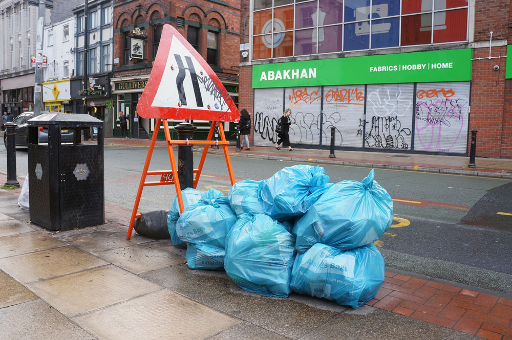 Waste Management is a real problem. A handful of bin bags in a centric neighbourhood. Northern Quarter. Published in The Green Bee. Author Juanele Villanueva