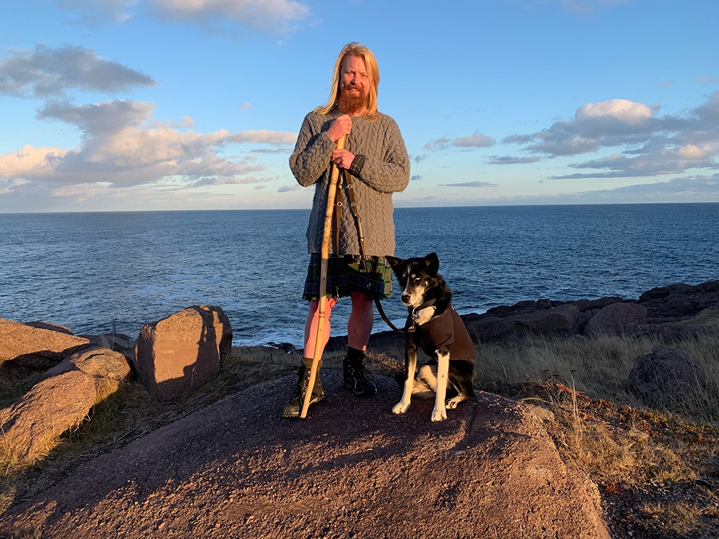 Michael Yellowlees with his dog luna geta picture at the end of its 5,000 miles trek. the scott who trekked canada